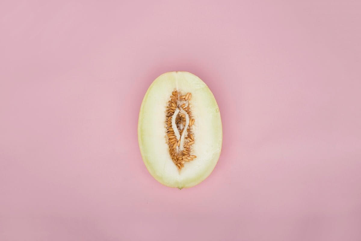 Exploring the Features and Benefits of the Caroline Masturbator Vagina and Anus represented creatively with fruit on pink background