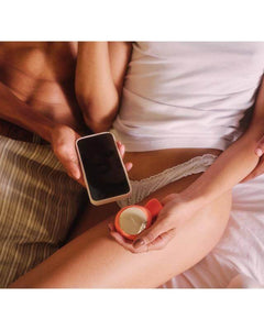 Couple using 📱APP CONTROLLED sex toy with smartphone for intimate pleasure.