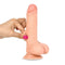 🎋REALISTIC lifelike dildo with suction base, held in hand, showcasing natural texture and flexibility for authentic sensations.
