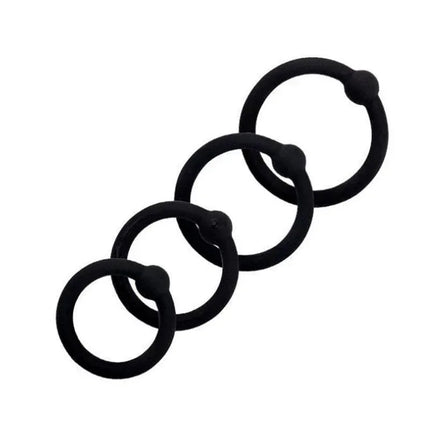 07 Set Solid Silicone Cock Rings in black, showcasing 4 rings from the Beast Rings premium collection for versatile sizing and performance.