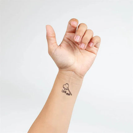 10 temporary Tattoos Candy Collection featuring 'Lick Me' tattoo on wrist.
