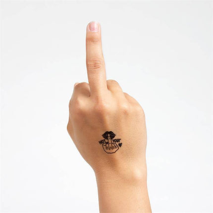 Hand displaying middle finger with 'Not Your Babe' tattoo, part of the 10 temporary tattoos Spicy Collection for bold expression.