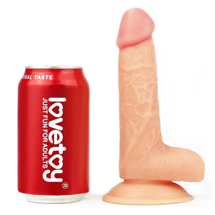 Dildo The Ultra Soft Dude 8 Flesh premium dildo by Love Toy next to a can for size comparison.