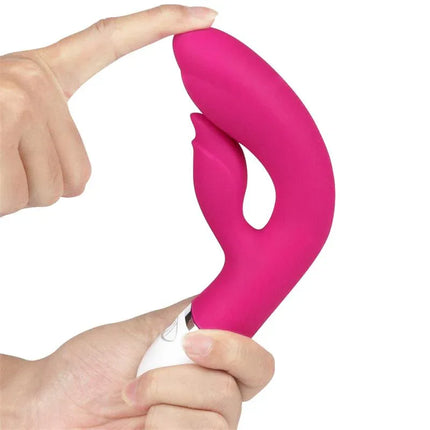 Vibe Dreamer II USB Rose Red vibrator with dual motors and flexible silicone design for enhanced pleasure, held in hand.
