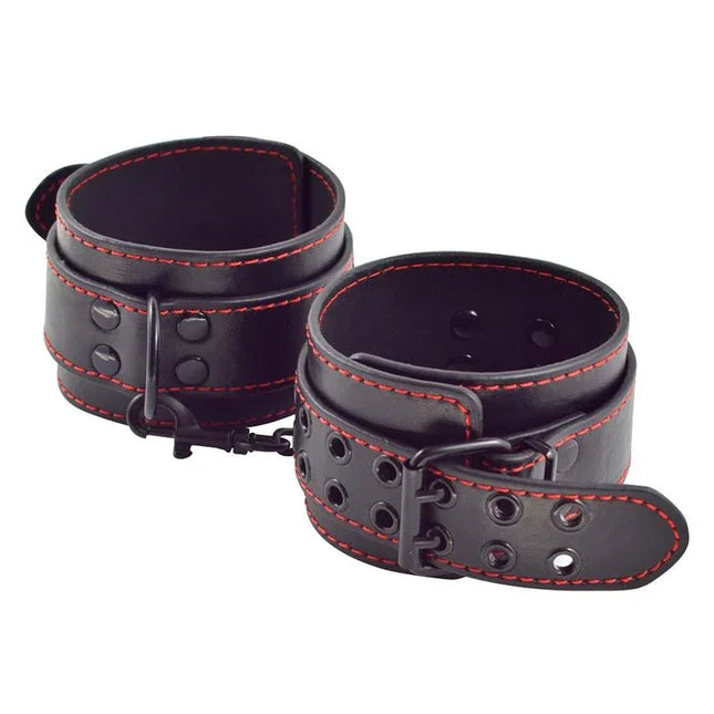 Ankle Cuffs Bondage Black faux leather restraints with red stitching, featuring secure and adjustable design for bondage sessions.
