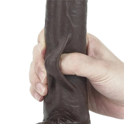 Hand squeezing Dildo Sliding 9 Black showcasing realistic texture and dual-density flexibility.