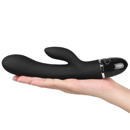 Vibe O-Sensual Clit Duo Climax Black luxury vibrator in hand, showcasing sleek design and premium body-safe silicone material.