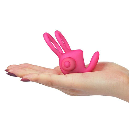 Hand holding Double Vibrating Cockring Power Clit Duo Pink, a silicone couple's toy with dual motors for enhanced pleasure and intimacy.