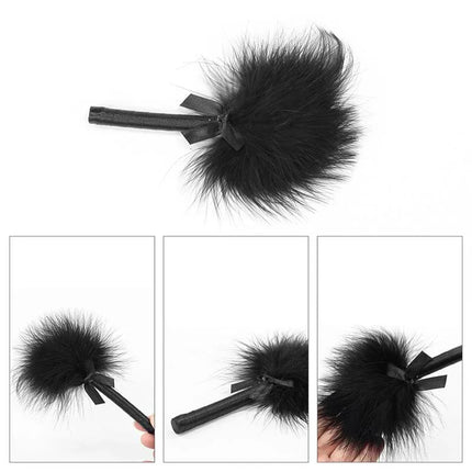 Bondage Kit Deluxe Black tickler made of soft black feathers, perfect for playful exploration and sensory experience in bondage play.
