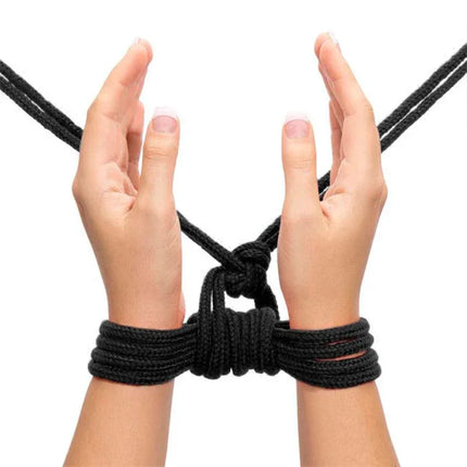 Hands tied with Rope Bondage Soft Black, showcasing durable and soft cotton texture for comfortable Japanese-style restraint.