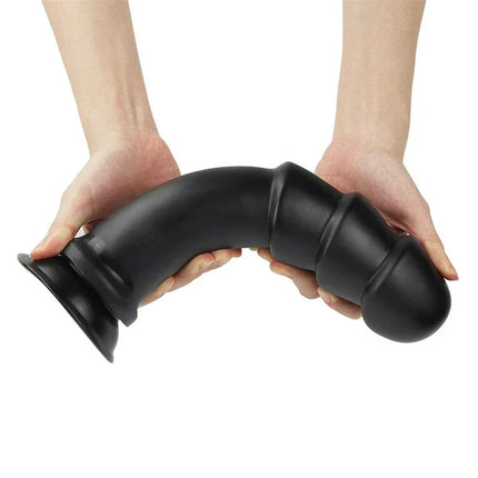 Dildo King Sized Anal Ripples 11.25 Black shown in hand, featuring flexible black shaft with ripples for extensive pleasure.