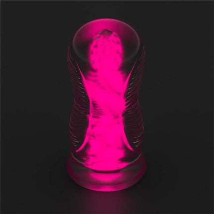 Lumino Play Masturbator Pink Glow 6.0 glowing in the dark with textured internal shaping for a satisfying experience.