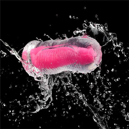 Lumino Play Masturbator Pink Glow 6.0 illuminated in water splash on black background