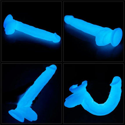 Dildo Lumino Play 10.5 glowing blue in the dark showcasing its flexible, body-safe design with visible glitter accents.