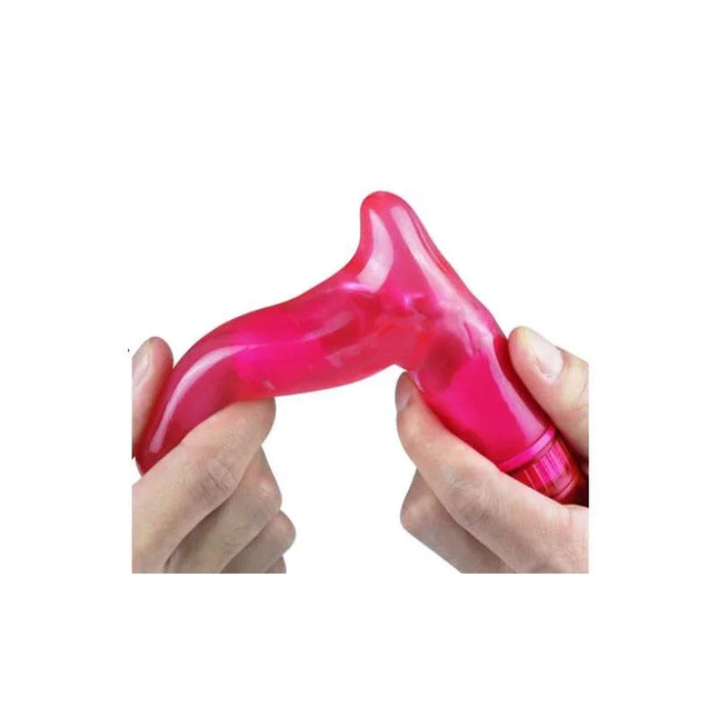 Hands holding the Vibe Fun Spot Momo G-Spot Pink vibrator, demonstrating its flexibility and vibrant pink color.