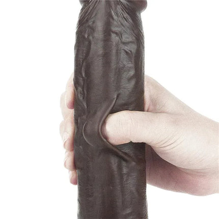 Hand gripping Dildo Sliding 9 Black, highlighting its realistic dual-density material and flexible design for enhanced pleasure.