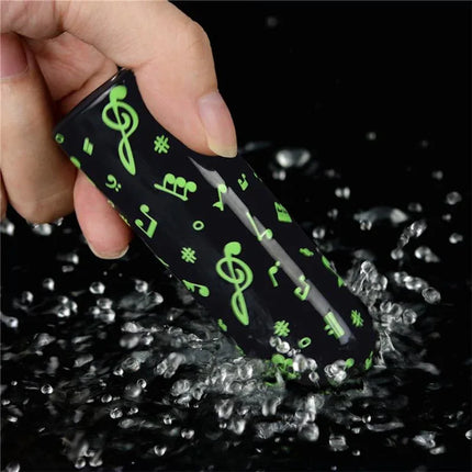 Vibrating Bullet Glow-in-the-dark with musical notes design submerged in water, highlighting glow-in-the-dark feature for easy locating.