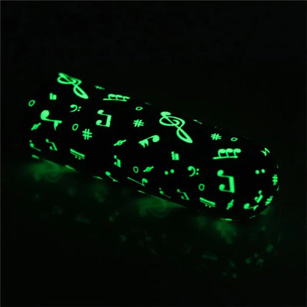 Vibrating Bullet Glow-in-the-dark with musical symbols pattern, shown glowing in low light.
