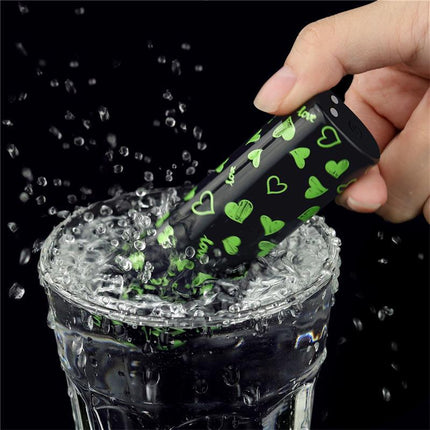 Vibrating Bullet Glow-in-the-dark being splashed in water, showcasing its compact size and glow-in-the-dark design.