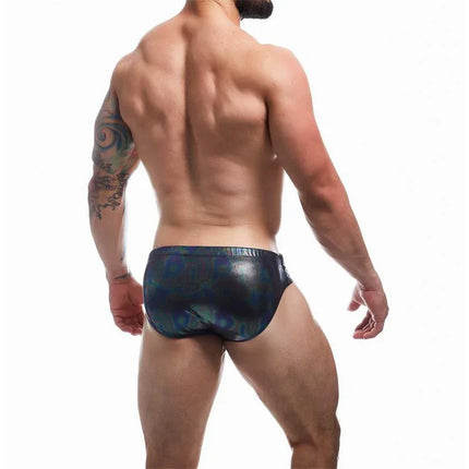 Man wearing C4M Emerald Swiwear Midnight swim trunks showcasing modern, stylish design with emerald accents for the beach or pool