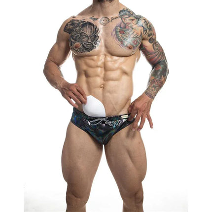 C4M Emerald Swiwear Midnight men's swimwear with modern silhouette and built-in padding, displayed on a male model with tattoos.