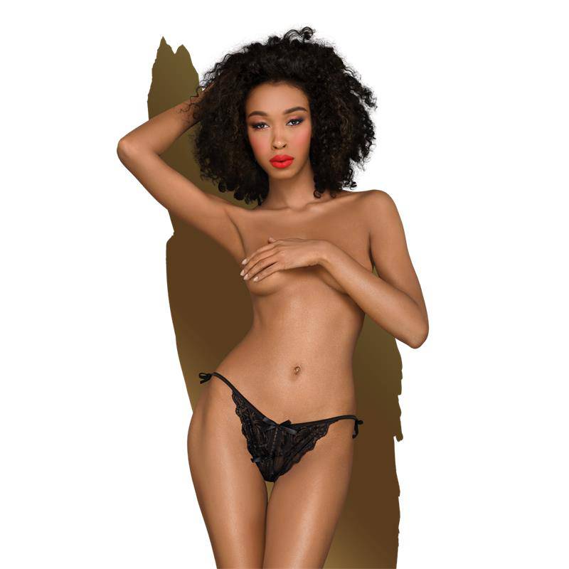 Black lace panties with floral embroidery and side tie closures on a model.