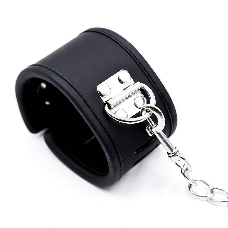 Black vegan leather collar with silver metal buckle and attached chain handcuffs.