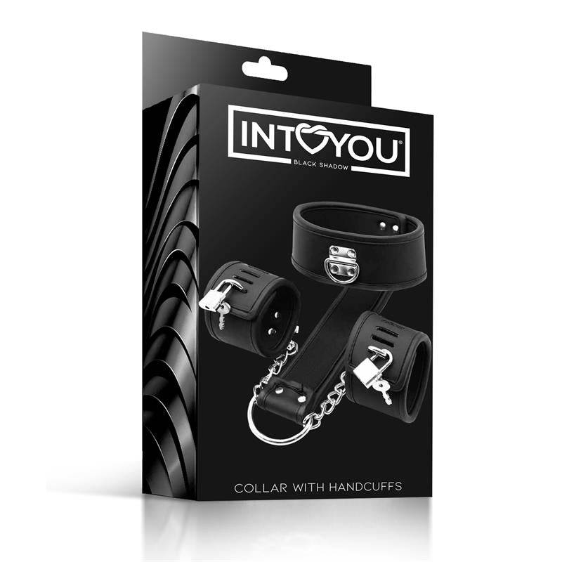 Black vegan leather collar and handcuff set with silver metal hardware in retail packaging.
