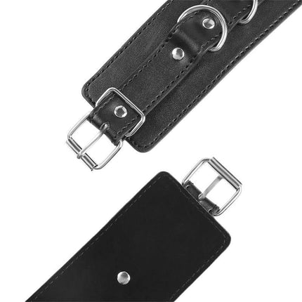 Close-up of black 3 D-Ring Handcuffs with adjustable strap and silver buckle, designed for consensual restraint from Latetobed BDSM Line.