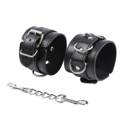 Black 3 D-Ring Handcuffs from Latetobed BDSM Line shown with connecting chain for versatile restraint.