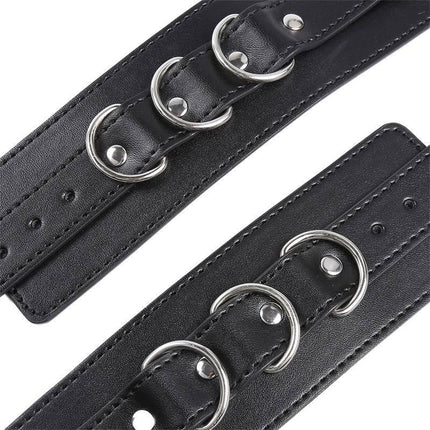 3 D-Ring Handcuffs from Latetobed BDSM Line, featuring black adjustable wrist cuffs with metal rings for consensual restraint.