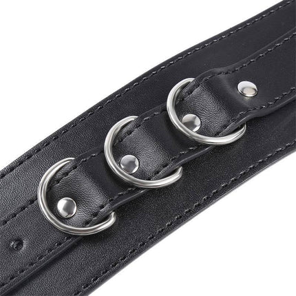 Close-up of 3 D-Ring Handcuffs from Latetobed BDSM Line, showcasing black leather with silver rings for versatile restraint and control.