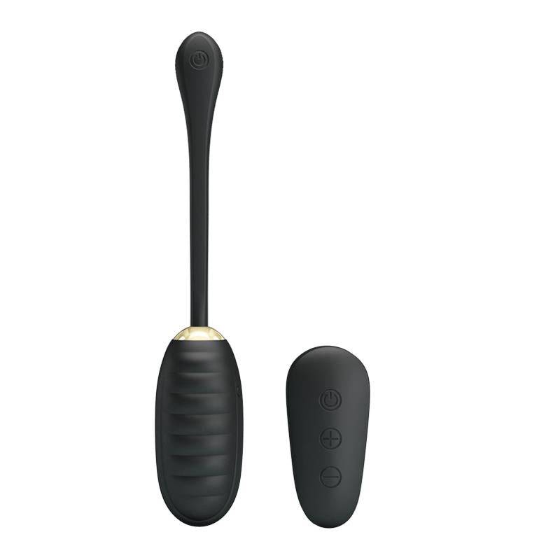 Black silicone kegel ball with textured tip and wireless remote control with three buttons.