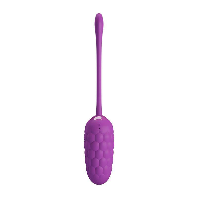 Purple silicone vibrating egg with textured honeycomb pattern and long, flexible tail.