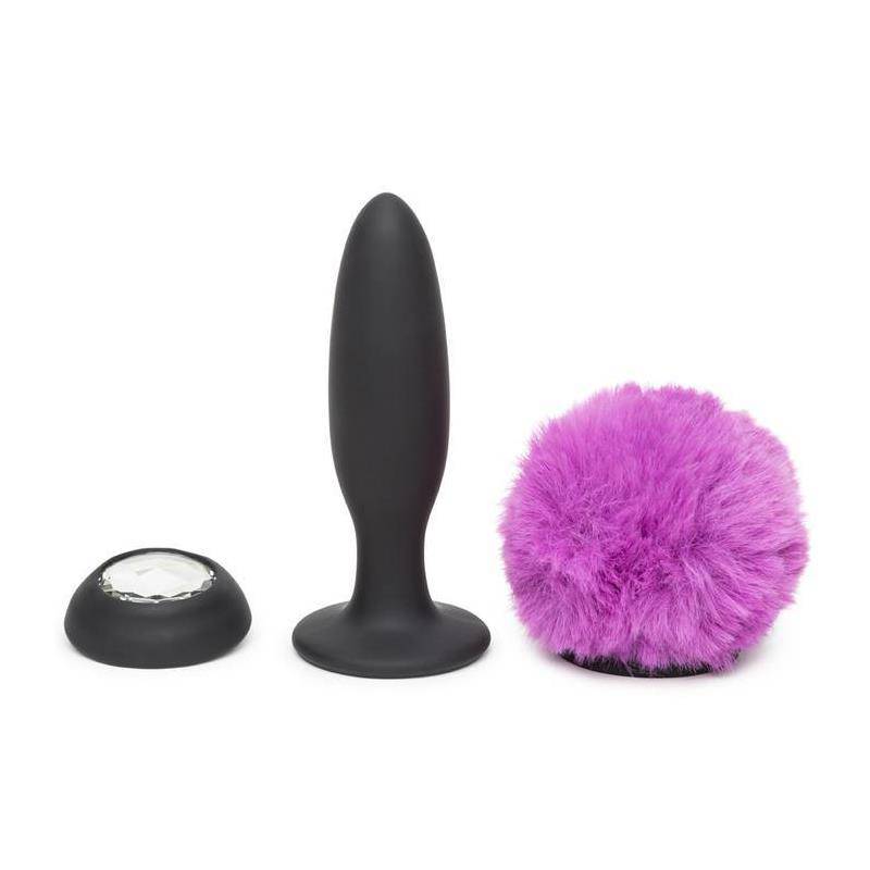 Large black silicone anal plug with double base and detachable fluffy purple tail accessory.