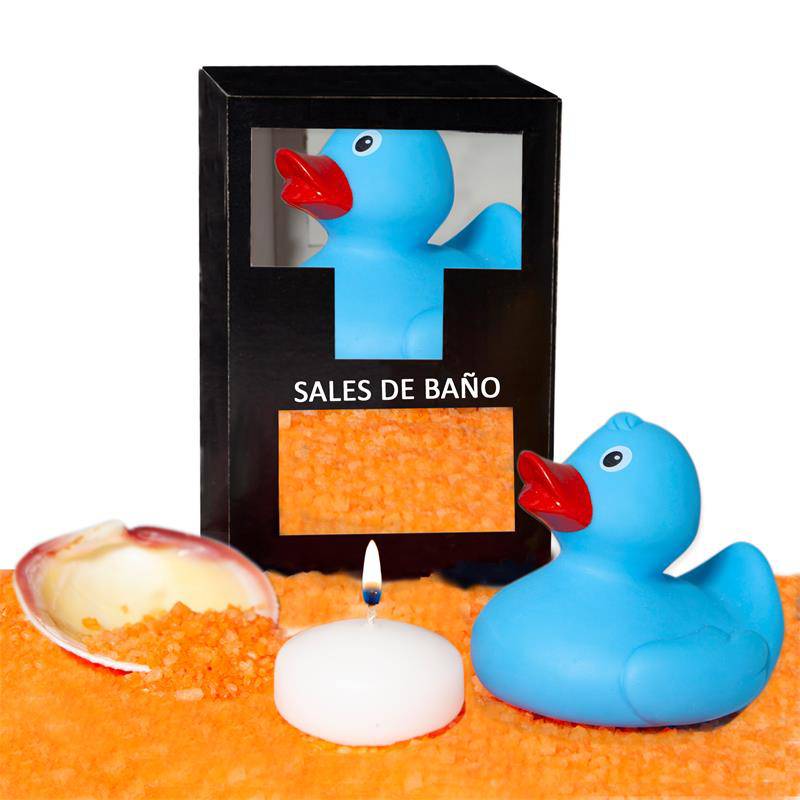Blue rubber duck with red beak, orange bath salts in shell, white tealight candle, black box with bath salts window.