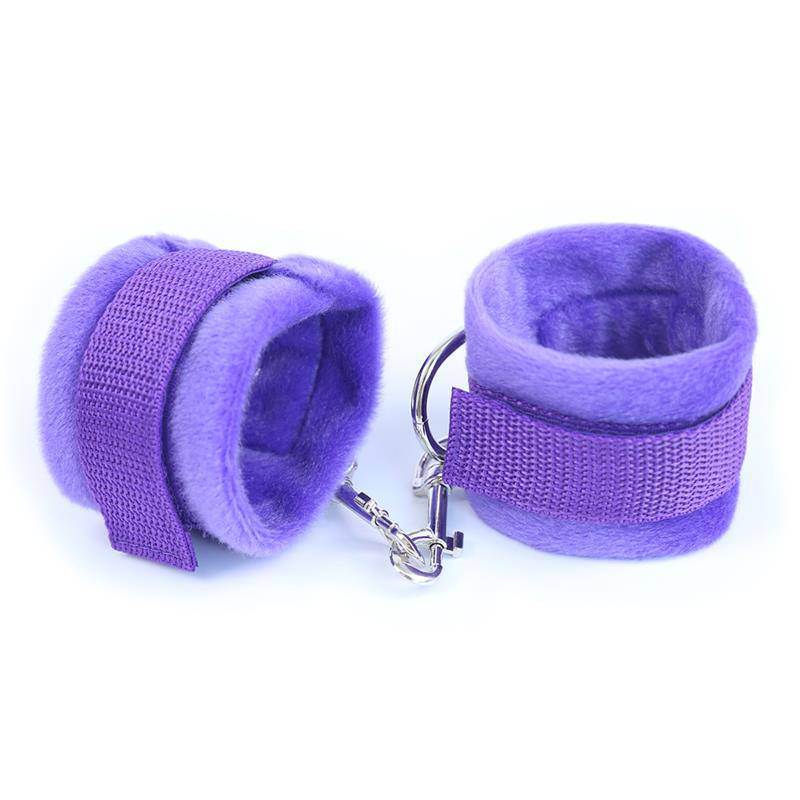 Purple velvet-covered handcuffs with adjustable Velcro straps and metal chain link connection.