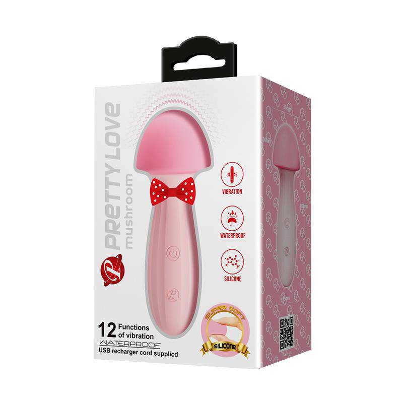 Pink silicone mushroom-shaped vibrator with red bowtie detail and USB charging icon on white packaging box.