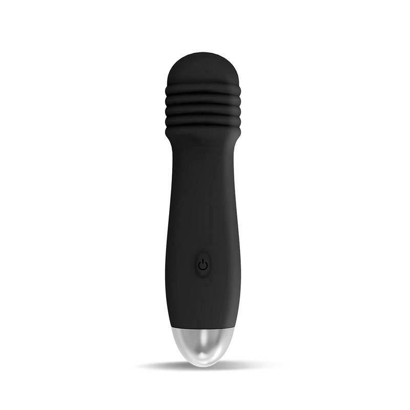 Black compact stimulator with textured rounded head and silver base, single button control.