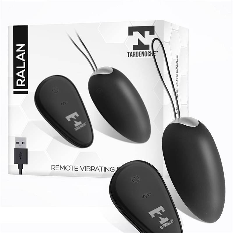 Black vibrating egg with remote control and magnetic USB charger alongside white and black product packaging with brand logo.