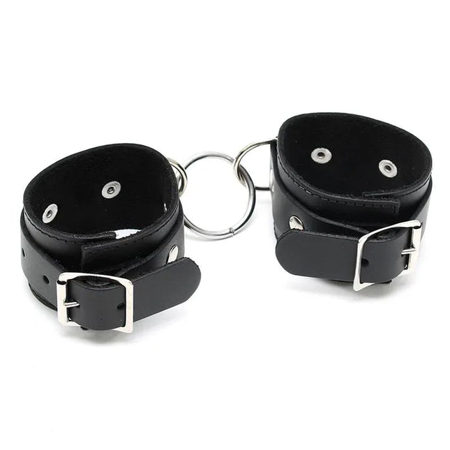 Cuffs Adjustable - Stylish leather bondage cuffs in classic black with adjustable buckles for comfortable, secure romantic play.