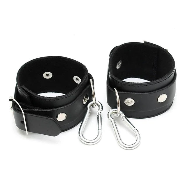 Cuffs Adjustable premium black leather bondage cuffs with an adjustable buckle system and sleek design for secure, comfortable fit.