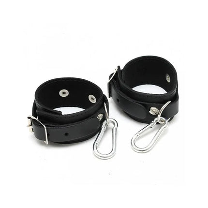 Hand Cuffs small 4 CM in black leather with carabiners for secure restraint, ideal for intimate play.