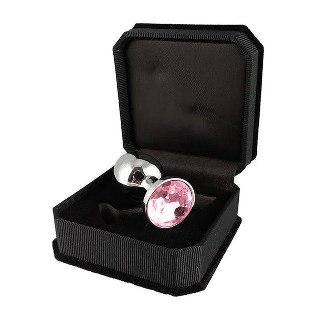 Plug Metal 7,3 cm in black box with pink glass element, showcasing its premium surgical steel design and conical tip for easy insertion.