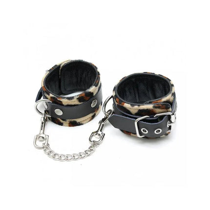 Leather hand cuffs with chain, featuring adjustable design in black and leopard pattern for couples exploring BDSM. Hand cuffs-Adjustable.