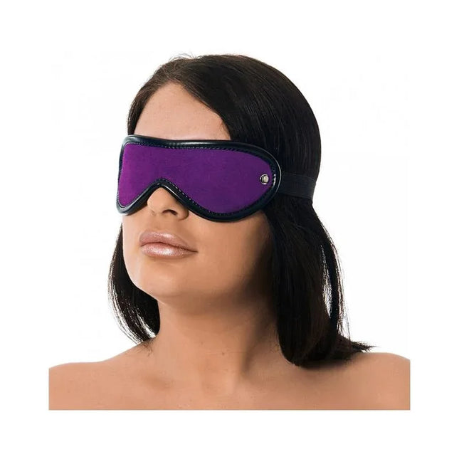 Person wearing a purple and black Blindfold Eye Mask for sensory play, made from soft leather with adjustable elastic back strap.