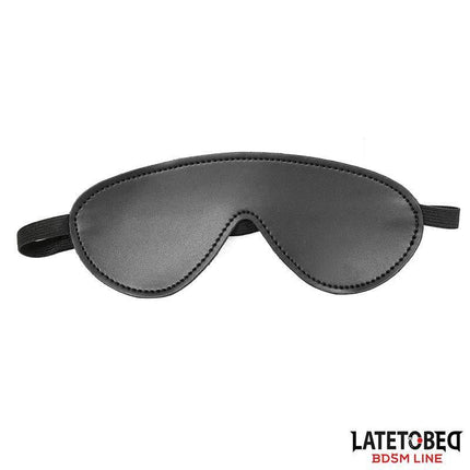 Black eye mask from 7 Bondage Pieces Set by Latetobed, featuring secure fit and soft texture for comfortable wear during BDSM play.