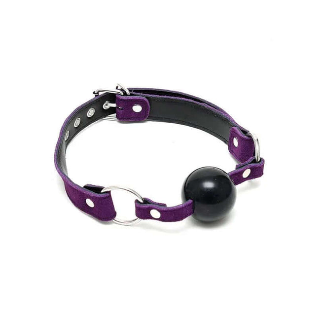 Mouthgag-Adjustable purple leather with black silicone ball, secure buckle fitting, BDSM accessory for safety and comfort.