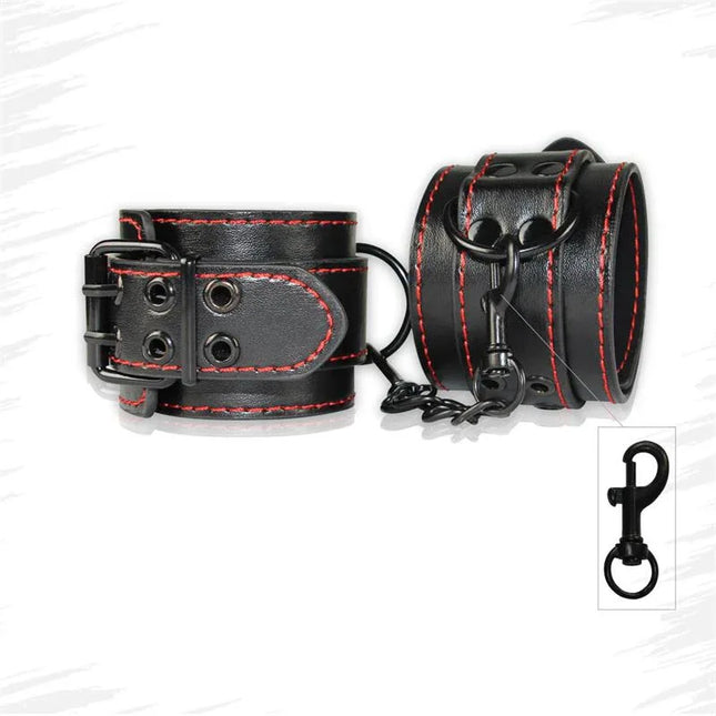 Handcuffs Bondage Black made of black faux leather with red stitching and adjustable straps for intimate play.