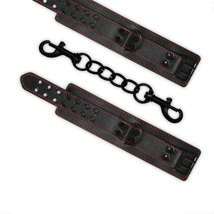 Handcuffs Bondage Black with adjustable faux leather straps for comfortable restraint, featuring durable black metal connectors.